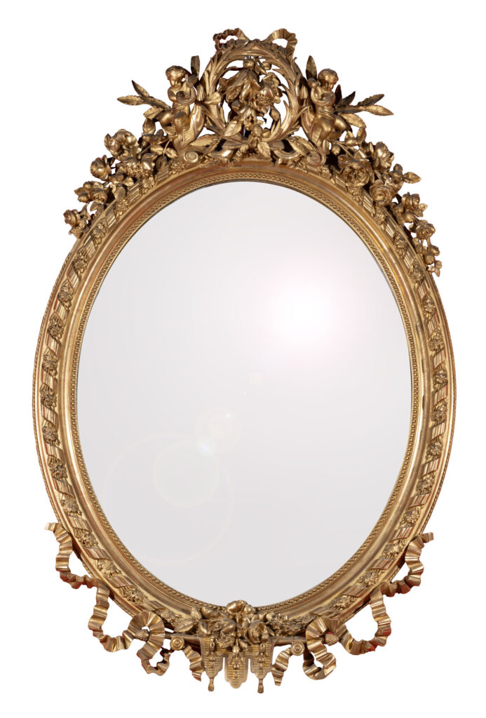 IMPORTANT MIROIR MÉDAILLON en bois stuqué et doré, la glace…