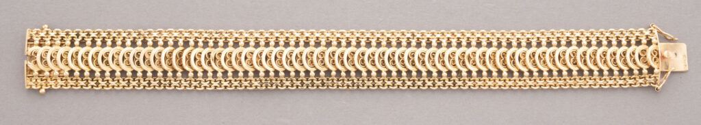BRACELET ruban en or jaune 750 millièmes, formé de mailles…