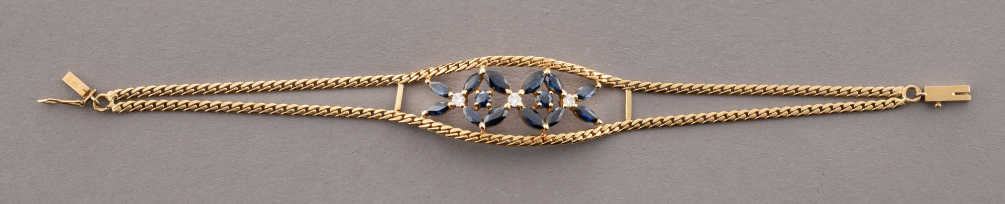 BRACELET en or jaune 750 millième, formé de deux chaines…